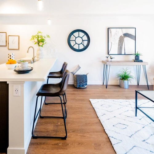 a kitchen with a dining table and chairs