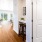 a room with white cabinets and a table