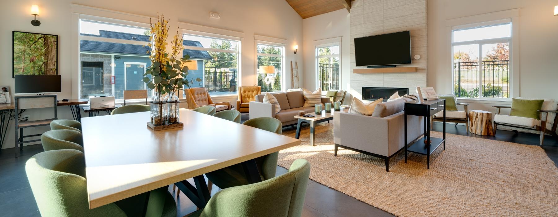 a large living room with a large chandelier and a large table