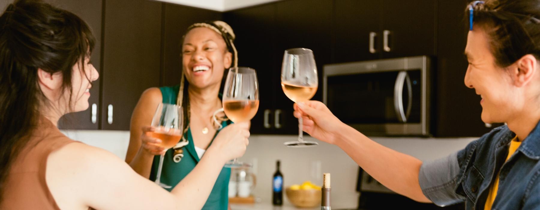 a group of people drinking wine