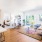 a living room with a bed and couch