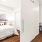 a bedroom with a bed and a table
