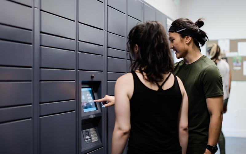 a man and woman looking at a computer screen