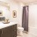 a bathroom with a tub sink and toilet