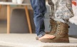 a soldier's boots and a child standing on the boots