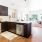 a kitchen with black cabinets